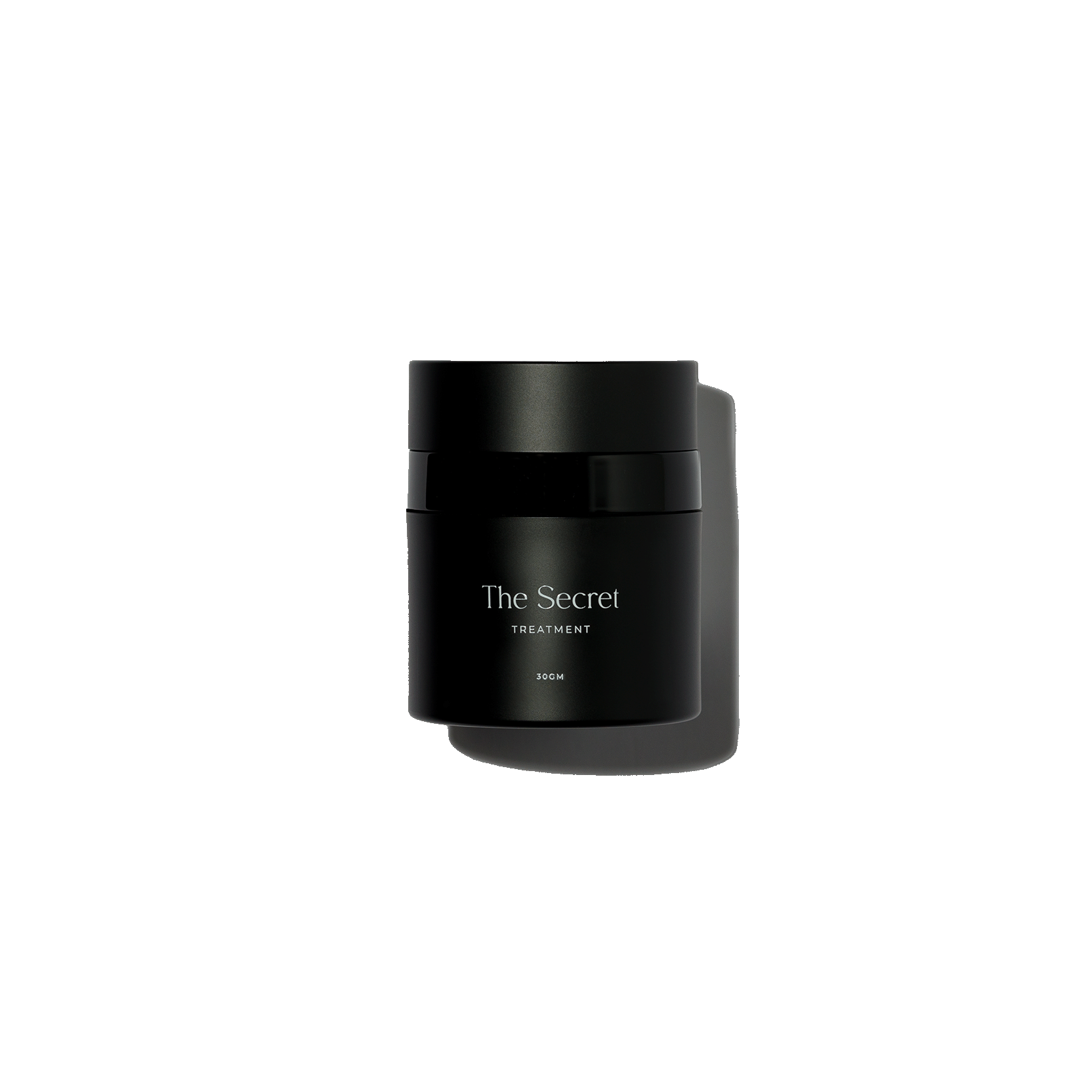 A black jar labeled 'The Secret' containing an acne spot treatment cream.