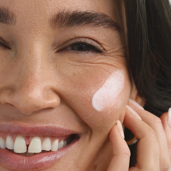 Young female with hydrated skin using The Secret Skincare